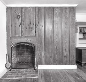 Paneled fireplace wall, hall chamber, 1792. Flame marks from can